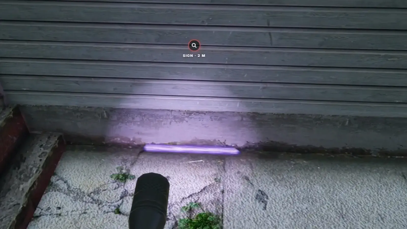 A first-person UV torch over a porch, a grease mark glowing violet along the foot of a clapboard wall with a sign marker above it