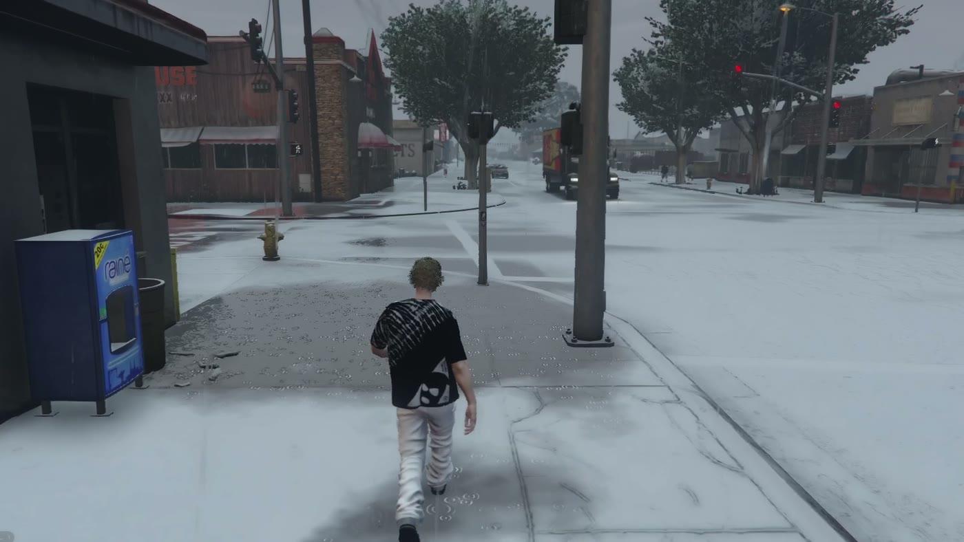 A player walking down a town street under snow cover with slush on the road