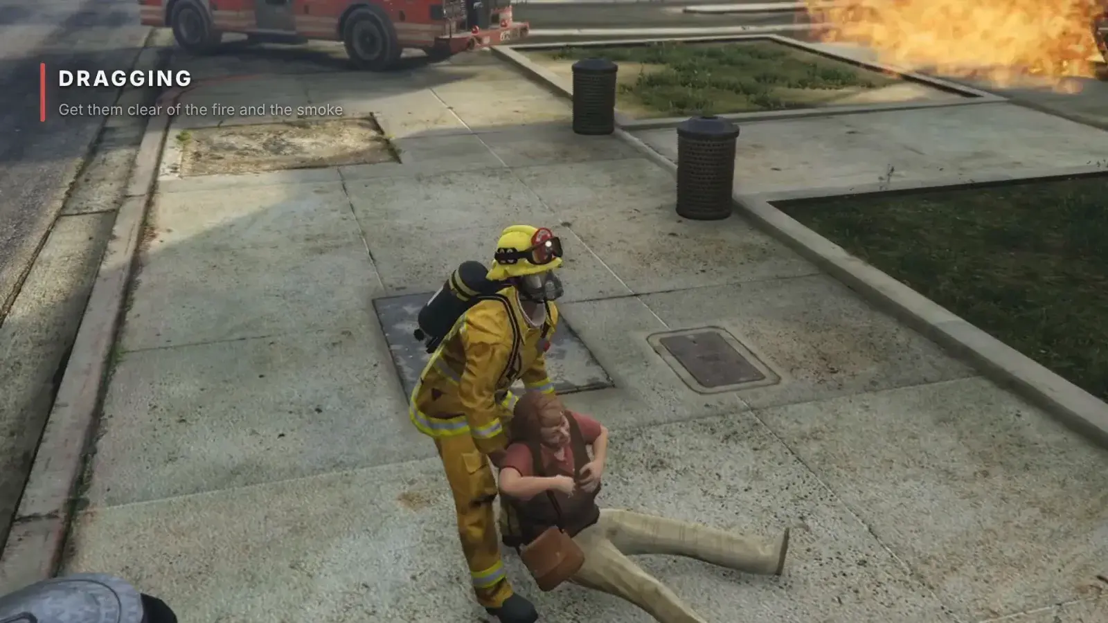 A masked firefighter drags a casualty under the arms along the pavement away from a fire, with the Dragging card