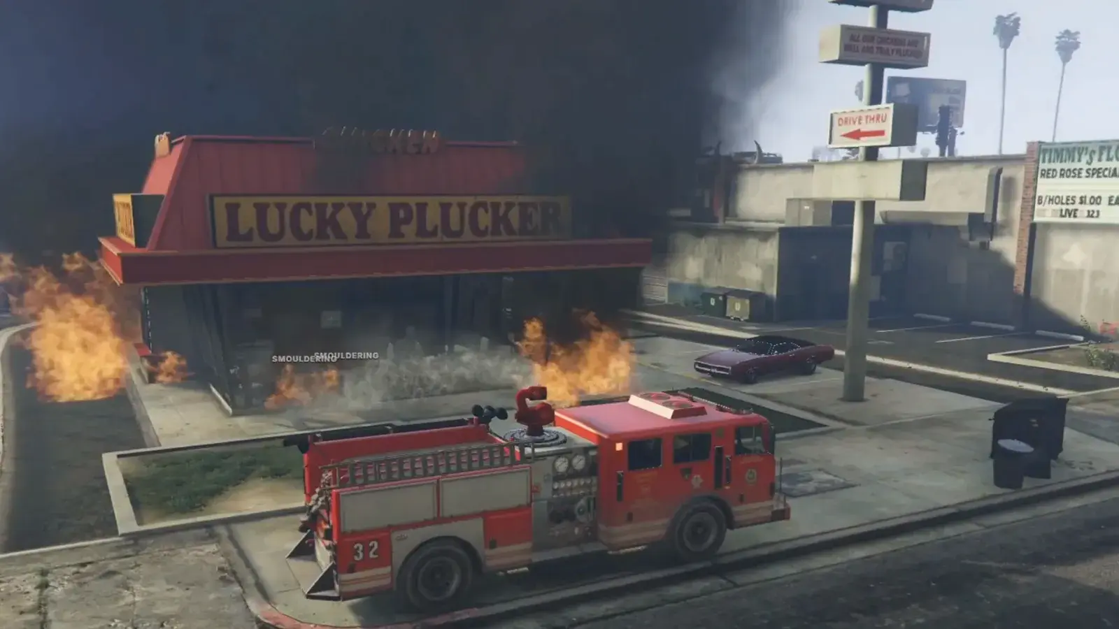 Engine 32 parked in front of the Lucky Plucker restaurant as flames burn along its front under black smoke